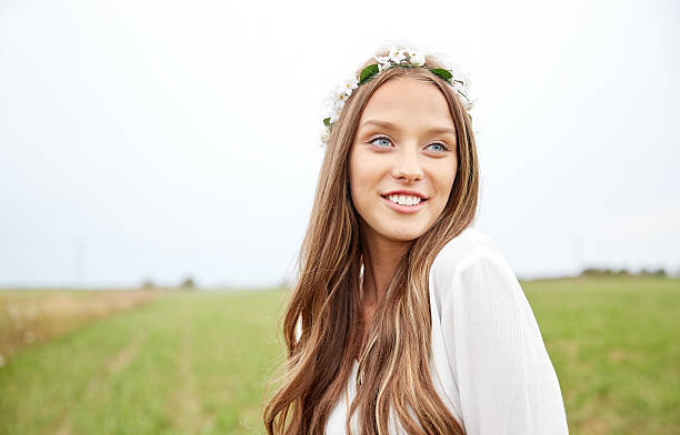 smiling young hippie woman on cereal field