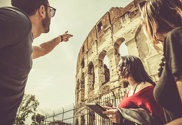 istock Tourists with a guide in front of the Coliseum, Rome 503680454