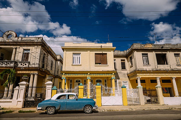 Typical residential street of Vedado, suburb of Havana, Cuba. Old houses in Art Deco style, showing the age of years of exposed in Caribbean sun and lack of renovations.