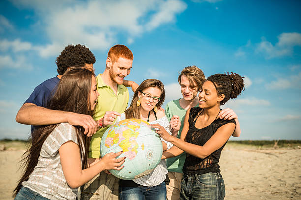 istock teenagers college student smiling with globe 503681426