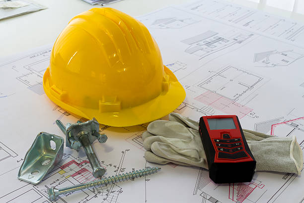 istock An office desk with the project papers and protective helmet 503681520