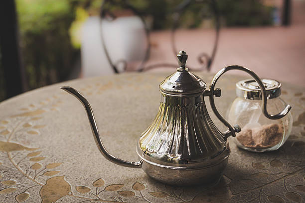 istock Old iron tea pot with sugar on the table 503683474