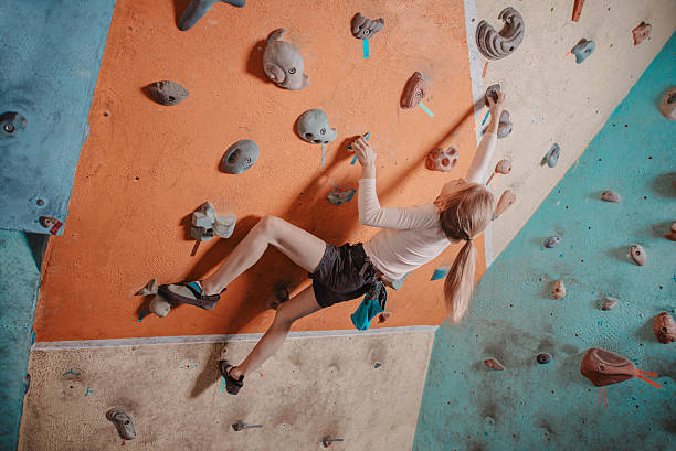 Climber girl training in gym stock photo