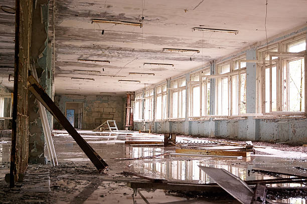 istock big abandoned hall with big broken windows 503687338