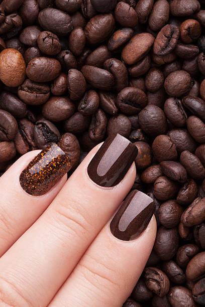 istock Brown nail polish on the nails. 503687950