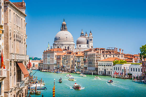 Canal Grande with Basilica di Santa Maria della Salute, Venice Beautiful view of famous Canal Grande with Basilica di Santa Maria della Salute in the background on a sunny day in summer, Venice, Italy. venice italy stock pictures, royalty-free photos & images