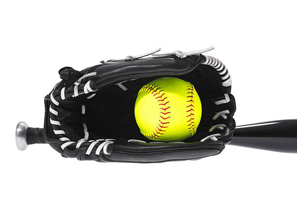 istock Yellow Softball in glove with bat on white background 503689390