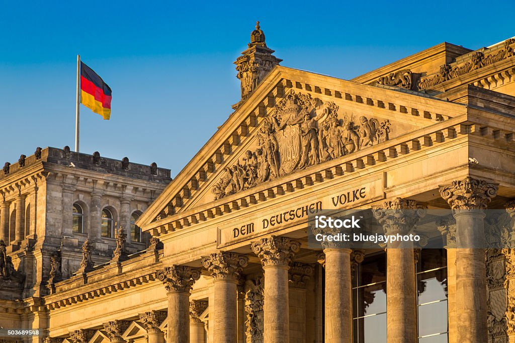 Reichstag building at sunset, Berlin, Germany Close-up view of famous Reichstag building, seat of the German Parliament (Deutscher Bundestag), in beautiful golden evening light at sunset, Berlin, Germany. Bundestag Stock Photo