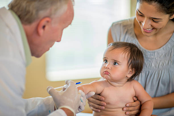 istock Cute Little Girl Getting a Shot 503689760