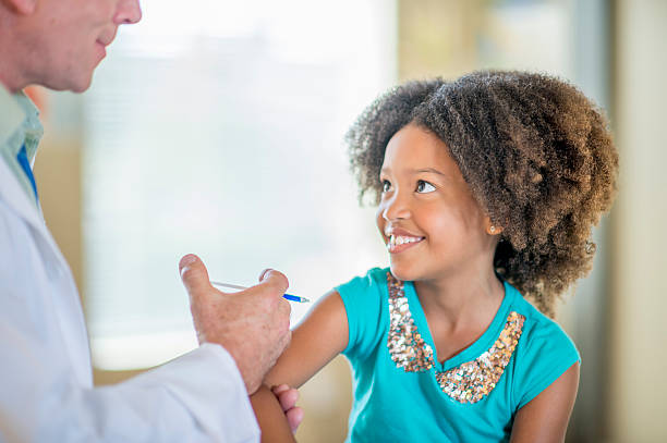 istock Cute Little Girl Getting a Shot 503689934