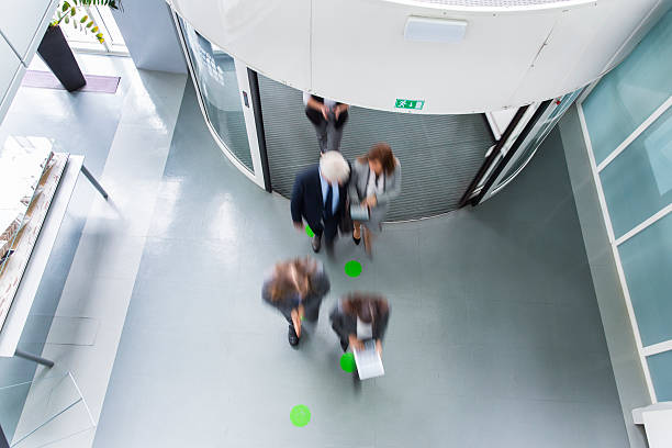 istock Group of ofiice worker entering through revolving door 503690836
