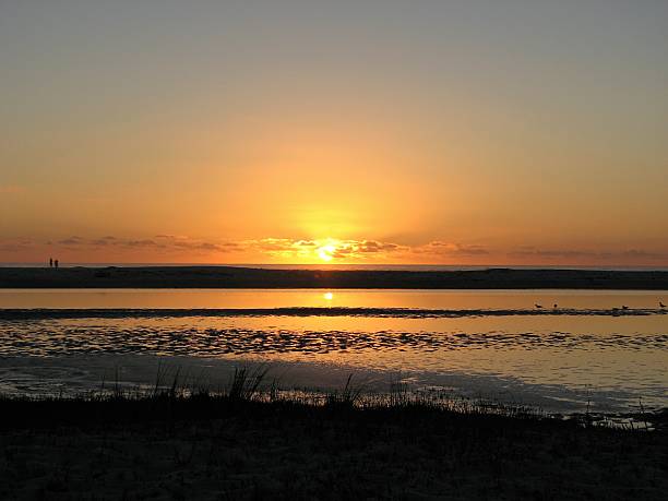 istock Noordhoek Beach and lagoon sunset reflection 503692842