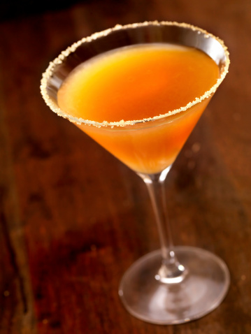 A glass of whiskey sour cocktail close up
