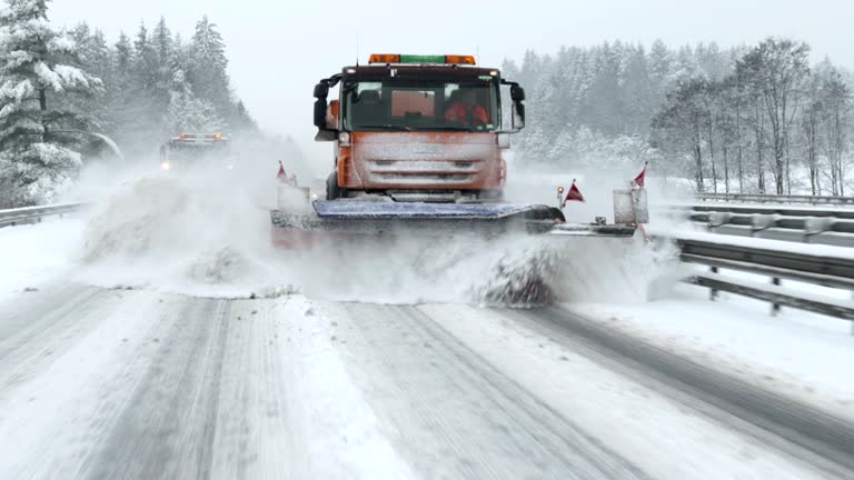 Snowplows Cleaning The Highway