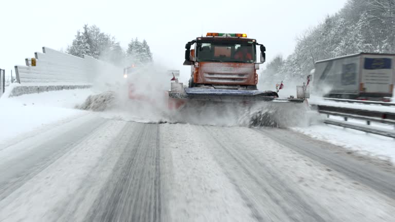 Snowplows Removing Snow From The Highway