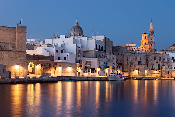 Nightview of Monopoli seaport. Italy. Panoramic nightview of Monopoli seaport. Apulia. Italy monopoli puglia stock pictures, royalty-free photos & images