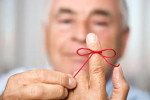 Photo of Man Knotting Rope For Memory