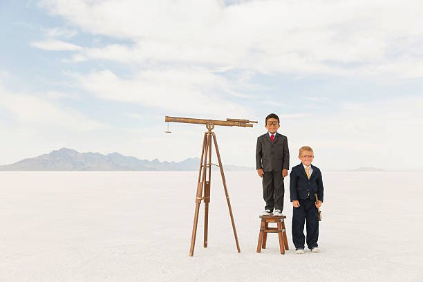 istock Young Business Boys with Telescopes 503707260