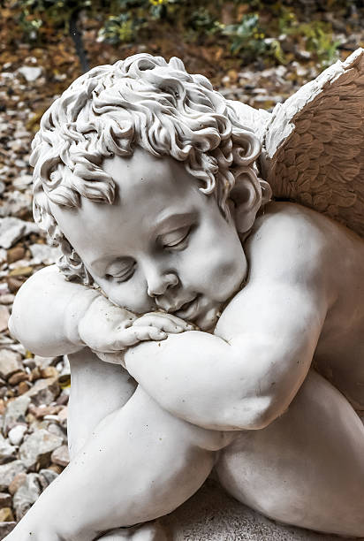istock Little asleep angel of stone 503708092