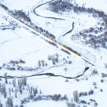 Freight train passing thru Steamboat springs, colorado shoot from a hot air ballon midair.