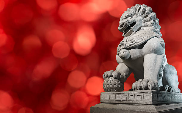 istock Chinese Imperial Lion Statue  on red background. 503712864