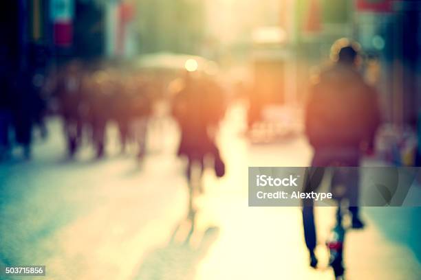 Cyclist In The Street Blurry Stock Photo - Download Image Now - Cycling, Bicycle, Walking