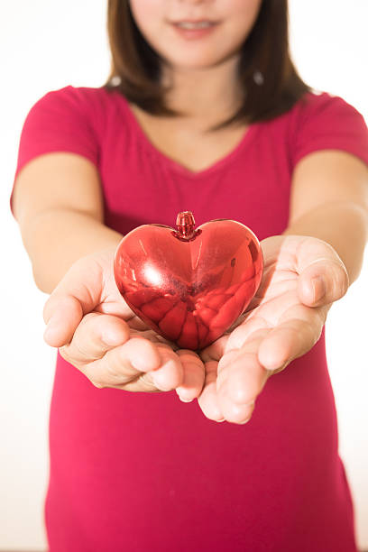 istock Woman show heart hands isolated on white 503719248