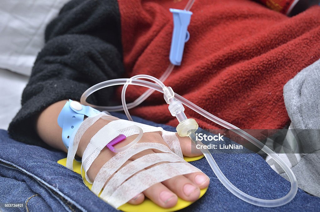 Infusion injection Child with saline intravenous (iv) in hospital Child Stock Photo