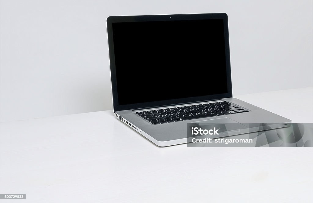 Opened laptop with isolated screen on white backgroung Desk Stock Photo