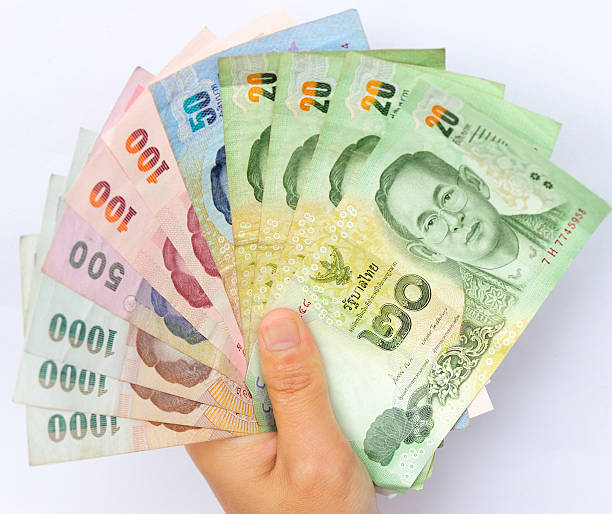 istock hand with thailand moeny 503730610