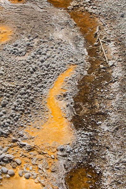 istock Orange stripes in hot spring runoff over limestone rock, Yellowstone. 503731344