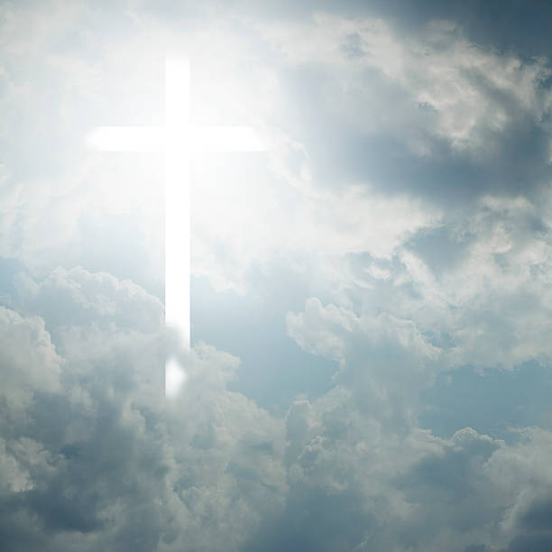 istock Religious cross of light on the blue sky 503731498