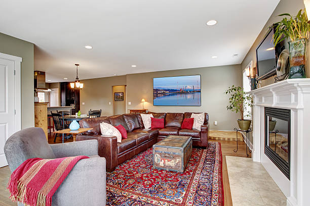 istock Living room with cozy fireplace and leather couch 503731617