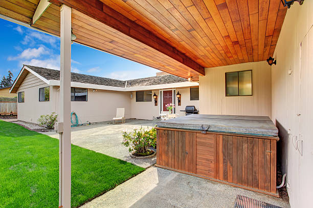 istock House exterior. Backyard deck with hot tub 503732029
