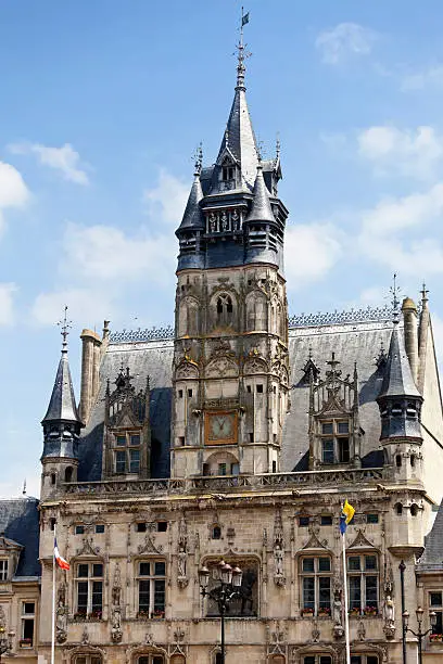 Compiegne Town Hall in Picardy, just north of Paris. This ornate gothic structure, the Hotel de Ville, or town hall, was built at the end of the 15th century during the reign of Louis XII,  and has a statue of him on the front facade. The belfry tower houses the Bancloque, a bell that has existed since 1303 and the three animated Picantin automata, a German, an Englishman and a Burgundian, dressed in 16th century costume, strike out the hours on the bells with their hammers.