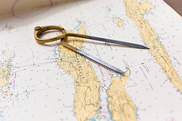istock Pair of compasses for navigation on a sea map 503732747