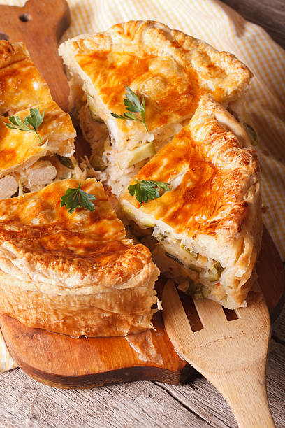 istock Homemade chicken pie sliced close-up on the table. Vertical 503733802