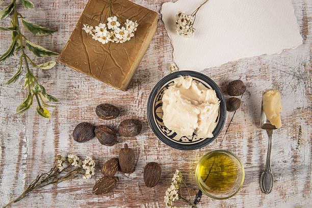 Shea butter with shea product and nuts stock photo