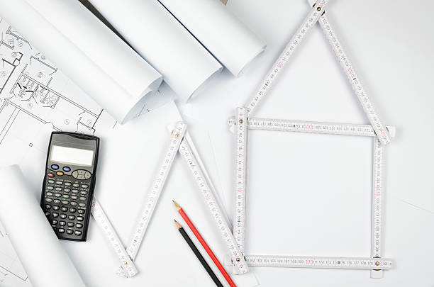 white meter tool forming a house and engineering tools white meter tool forming a house and engineering tools on white paper background turnkey project stock pictures, royalty-free photos & images