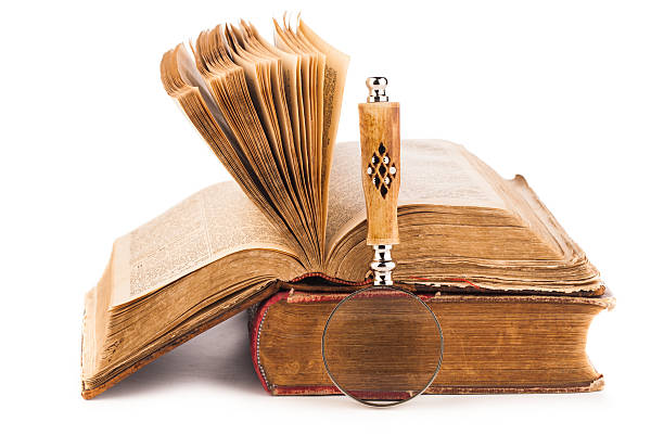 istock magnifying glass and old law books 503736696