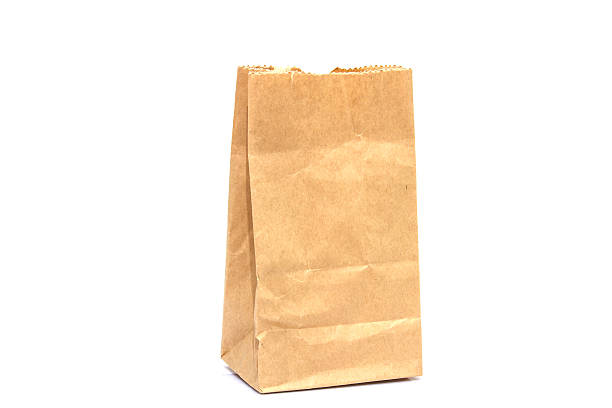 istock Brown paper bag isolated over white background 503738302
