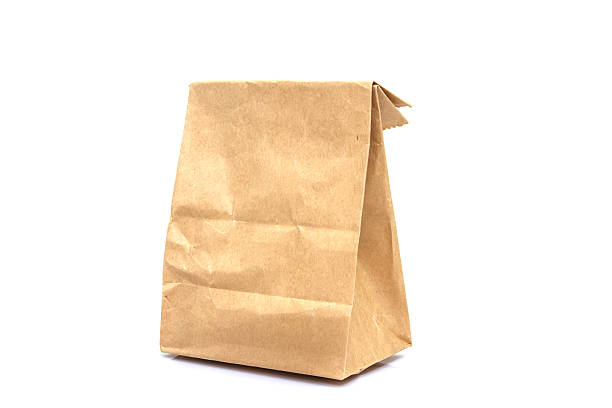 istock Brown paper bag isolated over white background 503738452