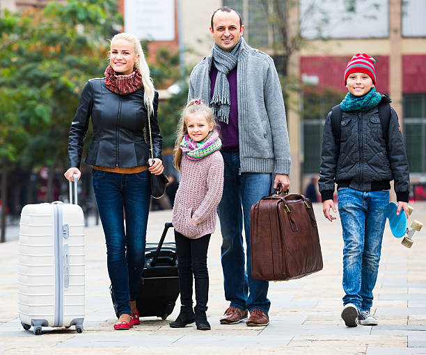 istock Parents with two kids  chasing streets 503738668