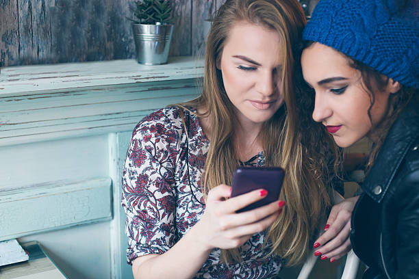 istock Girls at cafe surfing the net 503739286