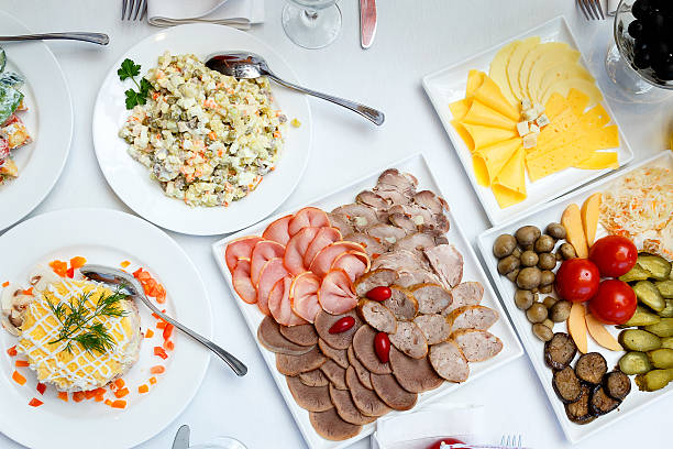 istock sliced sausages, pickles and salads on banquet table 503739938