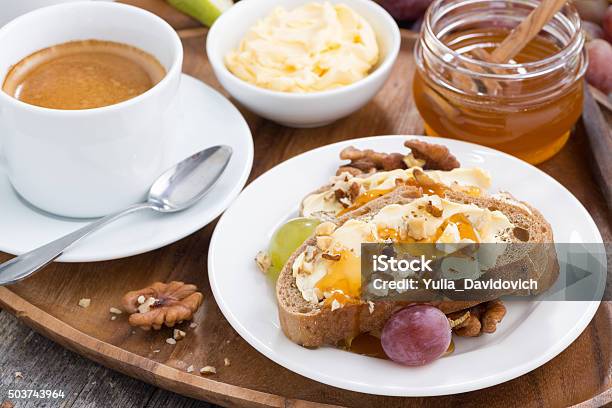 Bread With Butter Honey Nuts And Grapes For Breakfast Stock Photo - Download Image Now