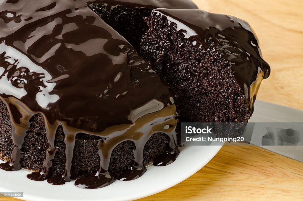 Dark chocolate cake Cutting of dark chocolate cake on plate Bakery Stock Photo