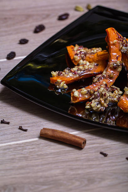 istock Roasted pumpkin on a black plate 503751894