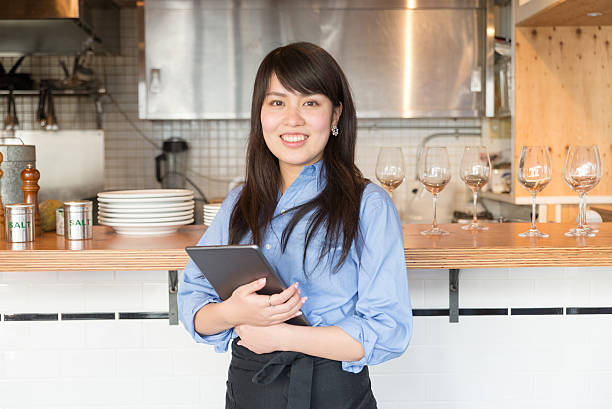 Young japanese lady manager of cafe restrant Young japanese lady manager of cafe restrant cafe culture photos stock pictures, royalty-free photos & images