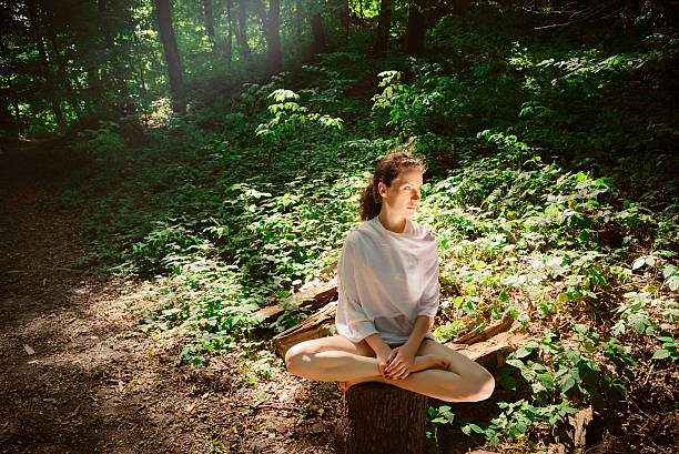 istock Young woman practicing yoga in nature 503753914
